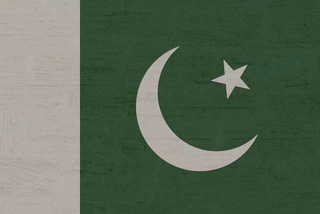 Flag of Pakistan with crescent and star on green background
