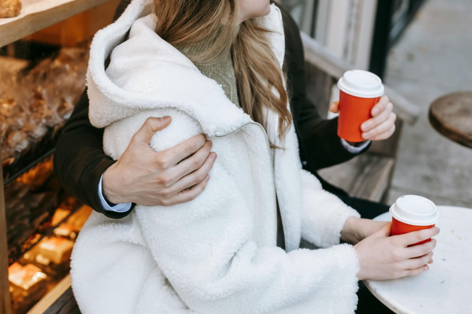 a couple hugging on a street