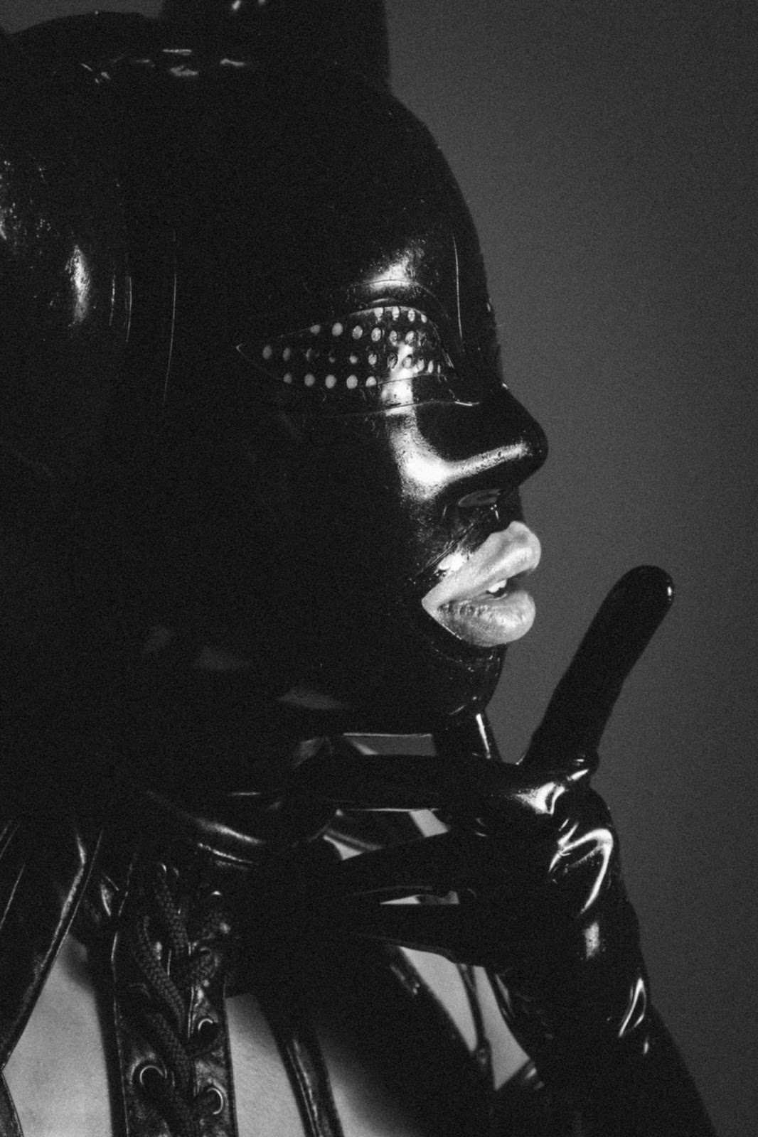 woman in a bdsm leather costume