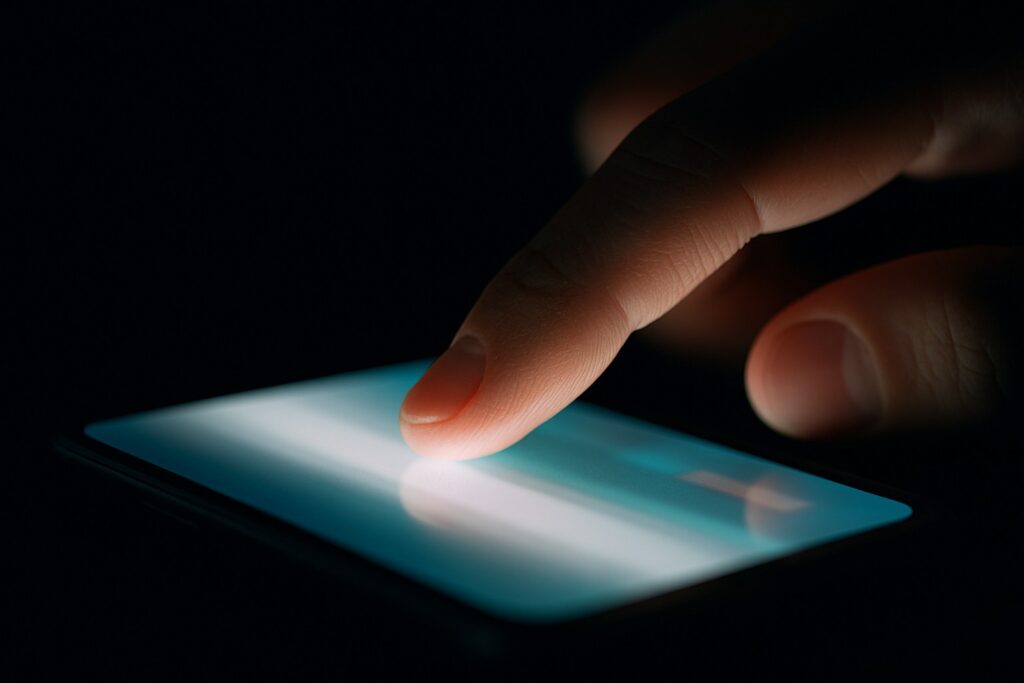 finger on phone
